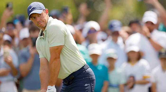 Rory McIlroy prepares for a shot on the 9th tee during the final round of the 2024 Players Championship at TPC Sawgrass in Ponte Vedra Beach, Fla.